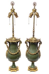 A Pair of French Gilt Bronze Mounted Porcelain Urns Height overall 33 inches.