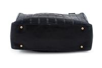 A Chanel Black Lambskin "Chocolate Bar" Tote, 8" H x 10" W x 3.25" D; Strap drop: 9".