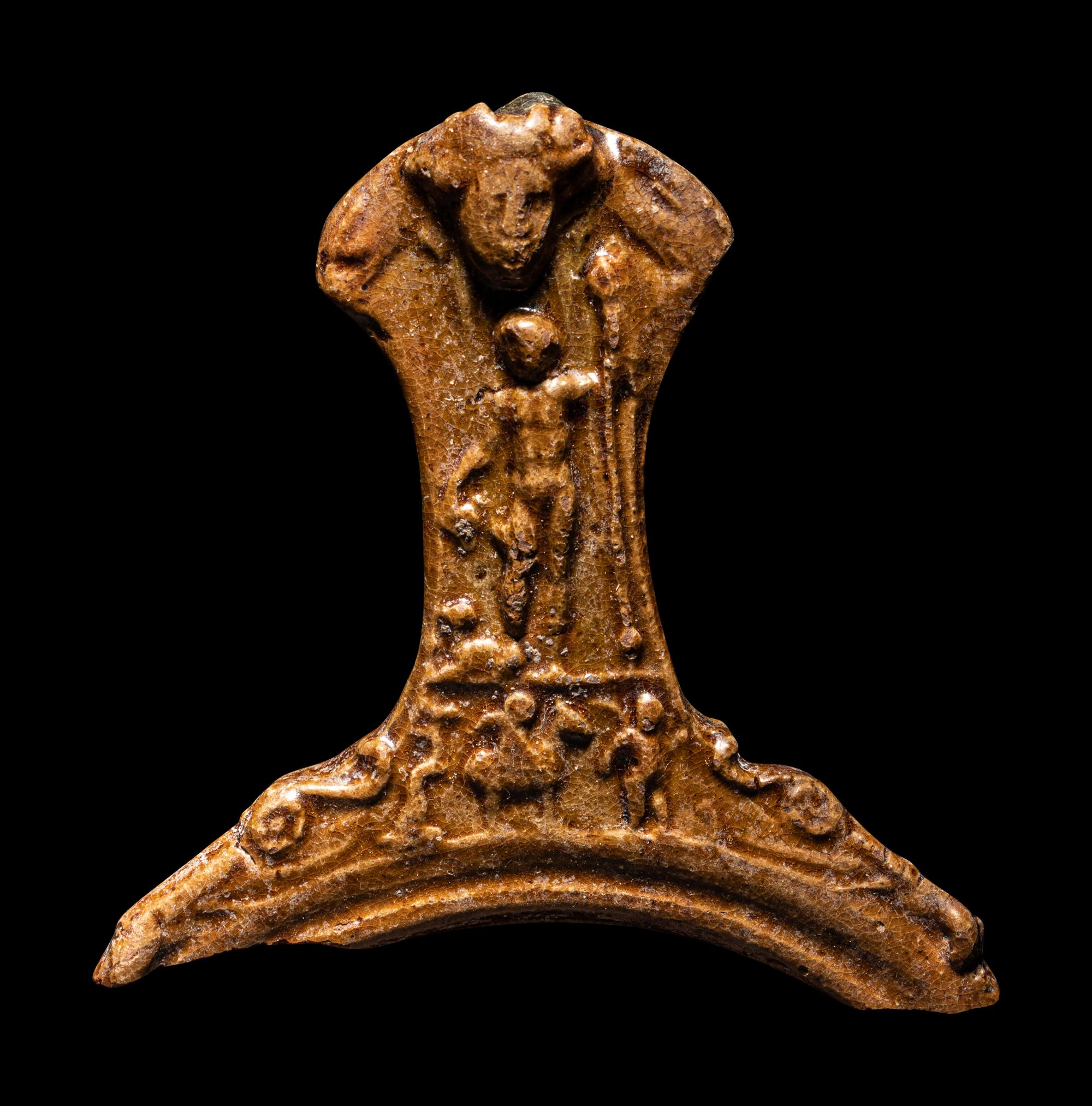 A Hellenistic Molded Glazed Pottery Handle
