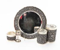 A Silver Mounted Smoking Set, , comprising a circular tray, ash receiver, match holder, tobacco jar and cigarette jar, all contained in