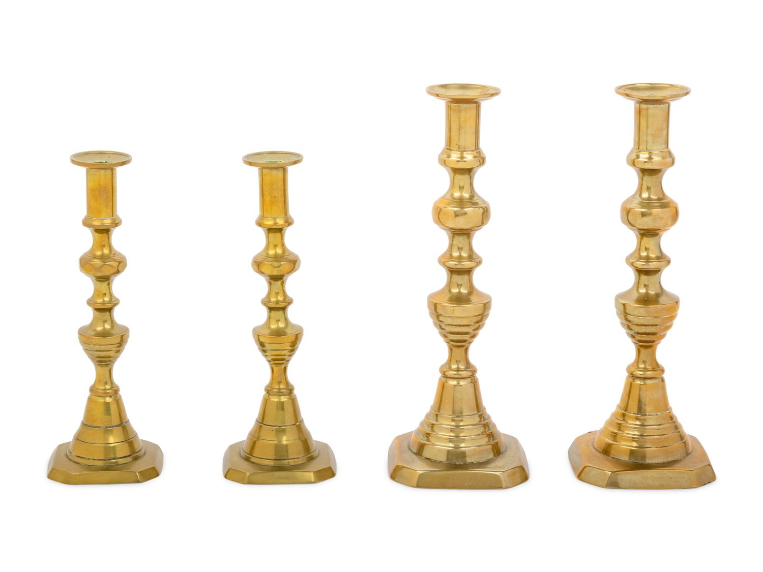 Four English Diamond Pattern Brass Candlesticks