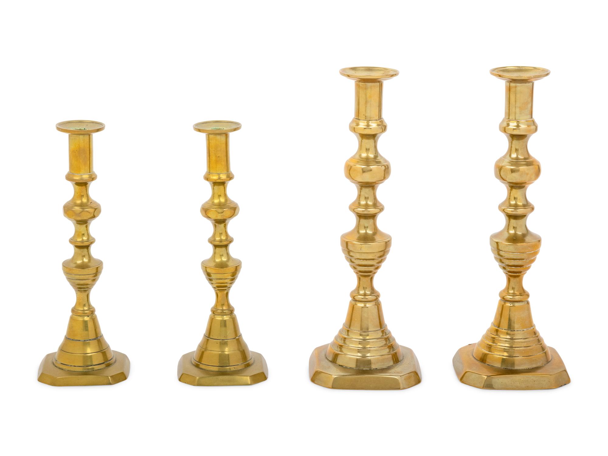 Four English Diamond Pattern Brass Candlesticks