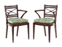 A Pair of Regency Carved Mahogany Cane Upholstered Armchairs