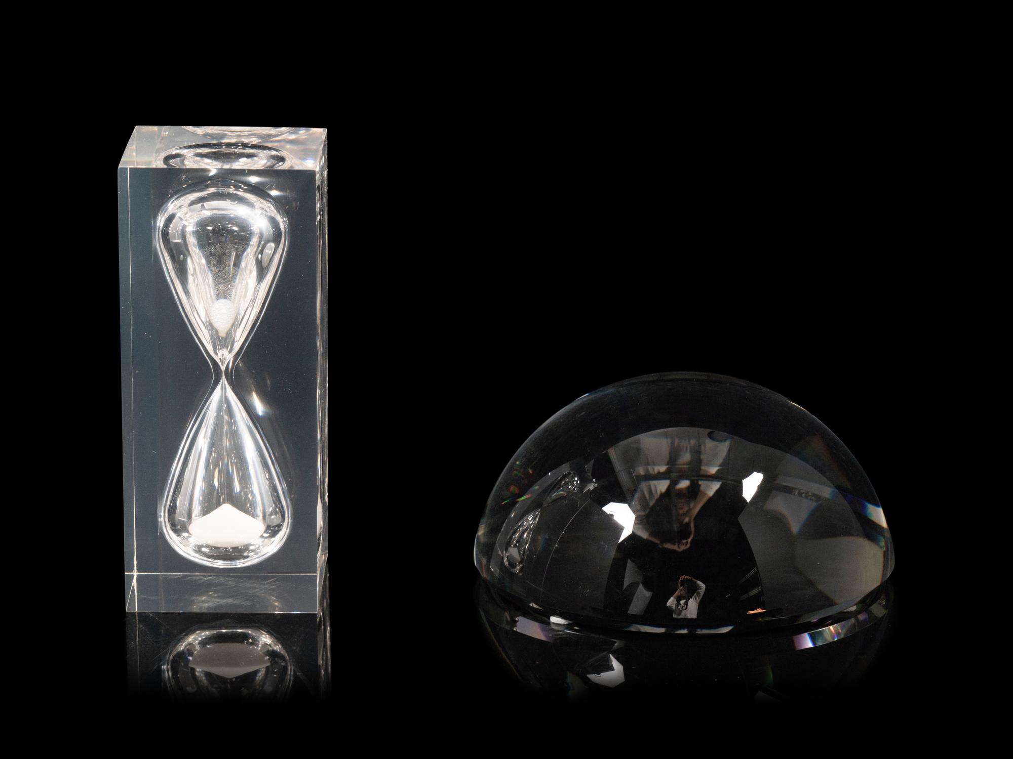 A Ralph Lauren Acrylic Clark Hourglass and a Glass Clayton Dome Paperweight
