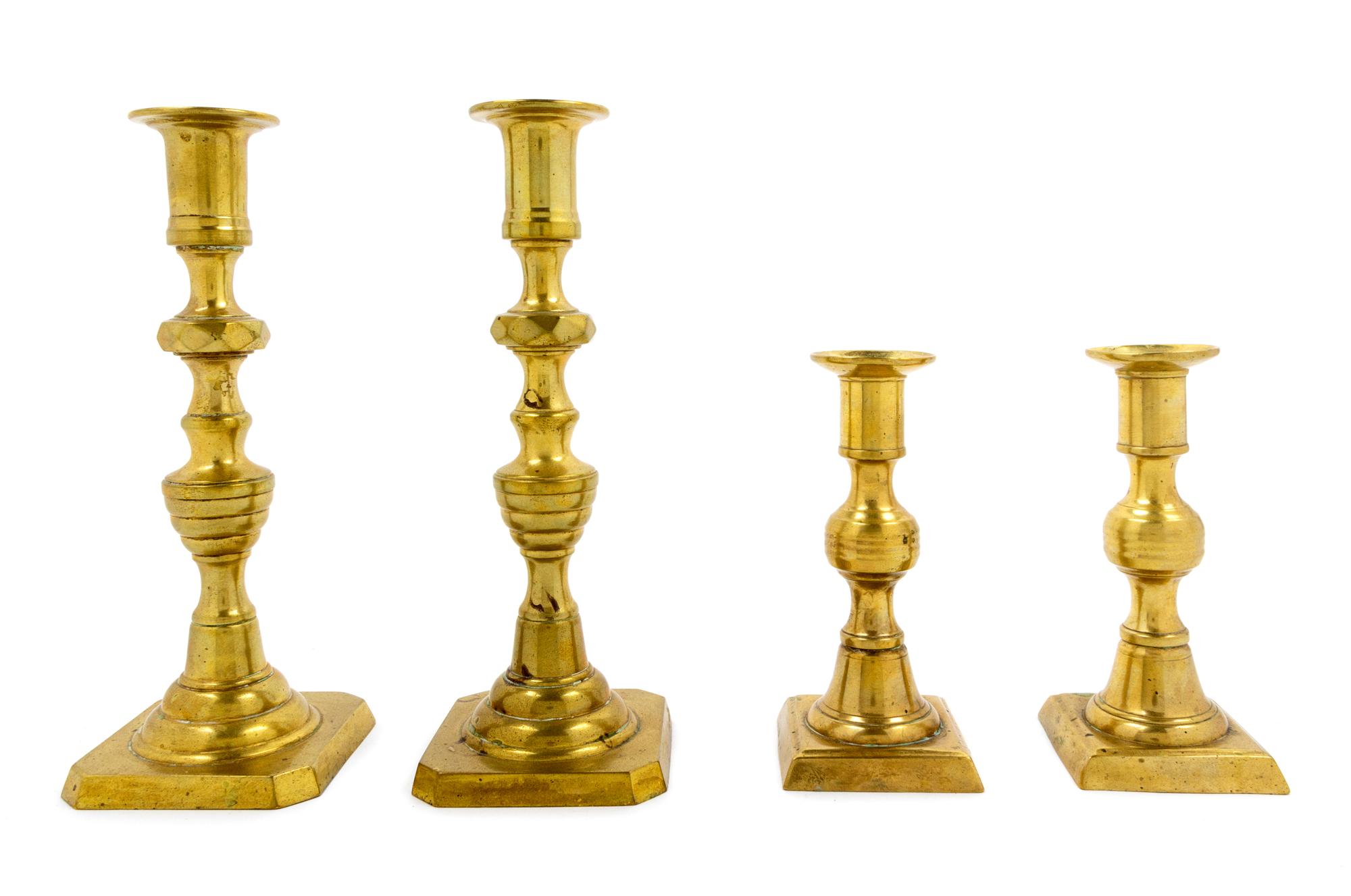 A Group of Four Brass Candlesticks