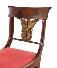A Set of Four Italian Parcel Gilt Walnut Side Chairs