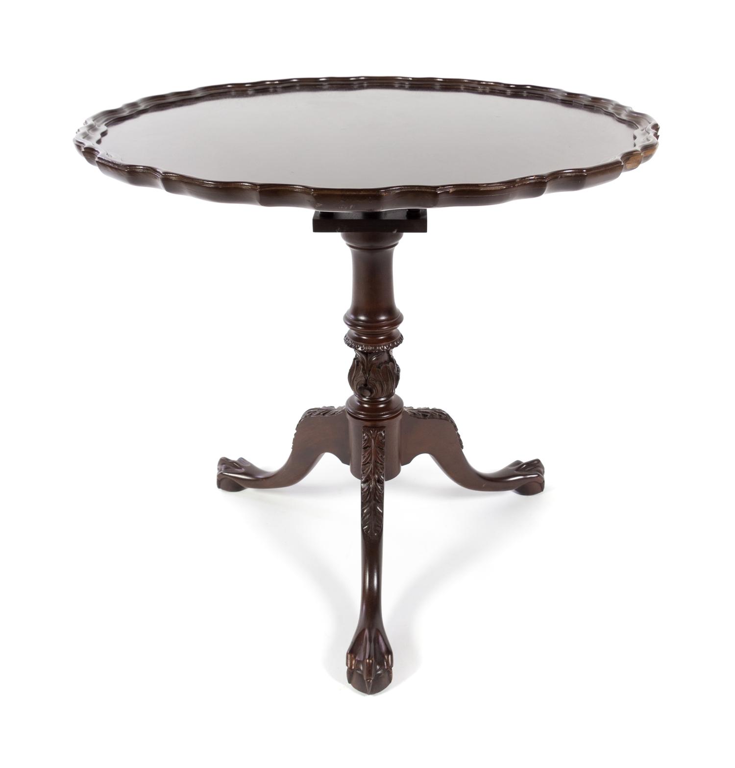 A Chippendale Style Mahogany Tea Table Height 29 x diameter of top 31 1/2 inches. — 20TH CENTURY
