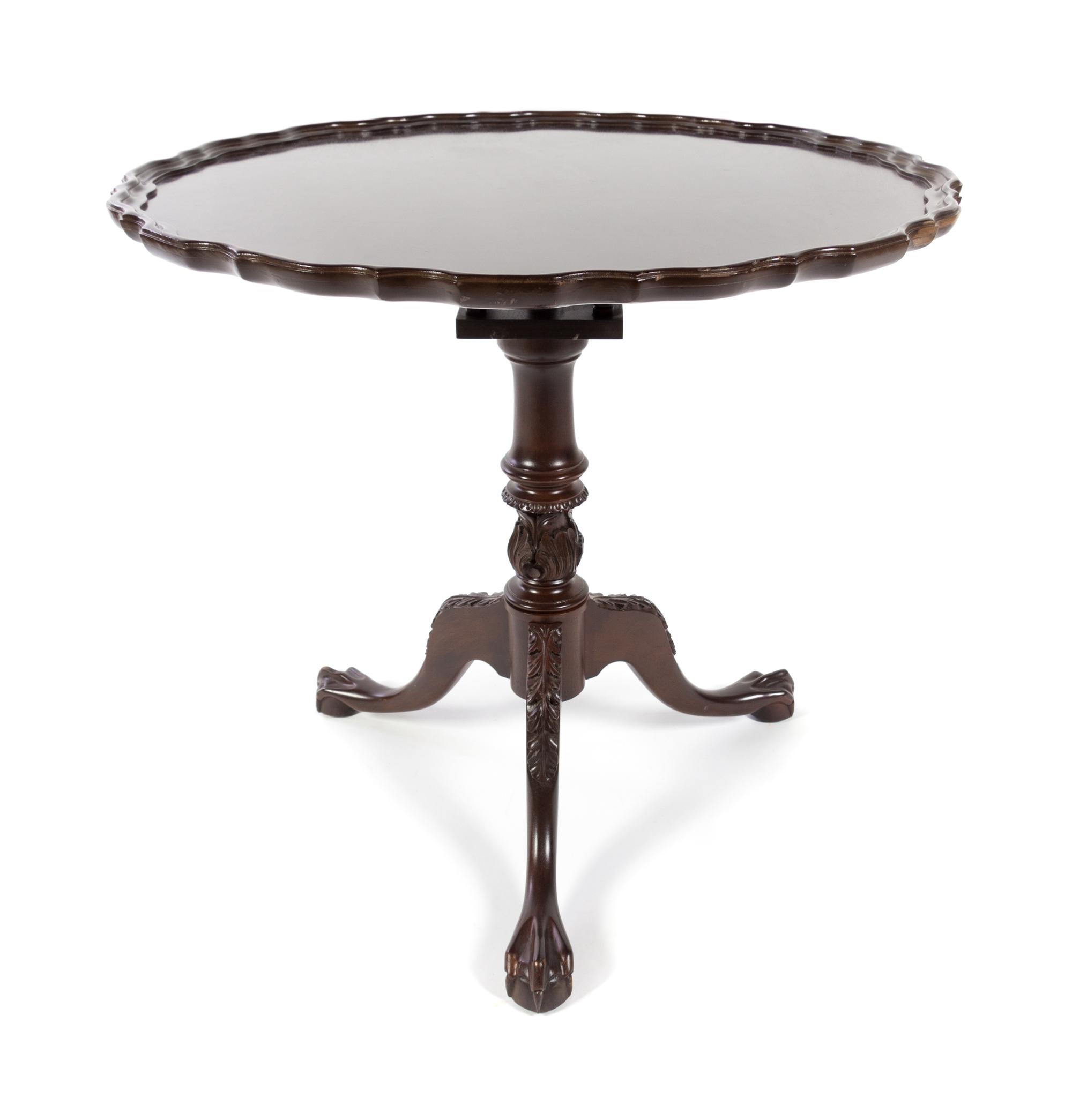 A Chippendale Style Mahogany Tea Table Height 29 x diameter of top 31 1/2 inches. — 20TH CENTURY