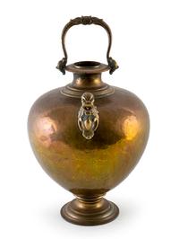 A Hand Beaten Metal Water Carrier — 20TH CENTURY