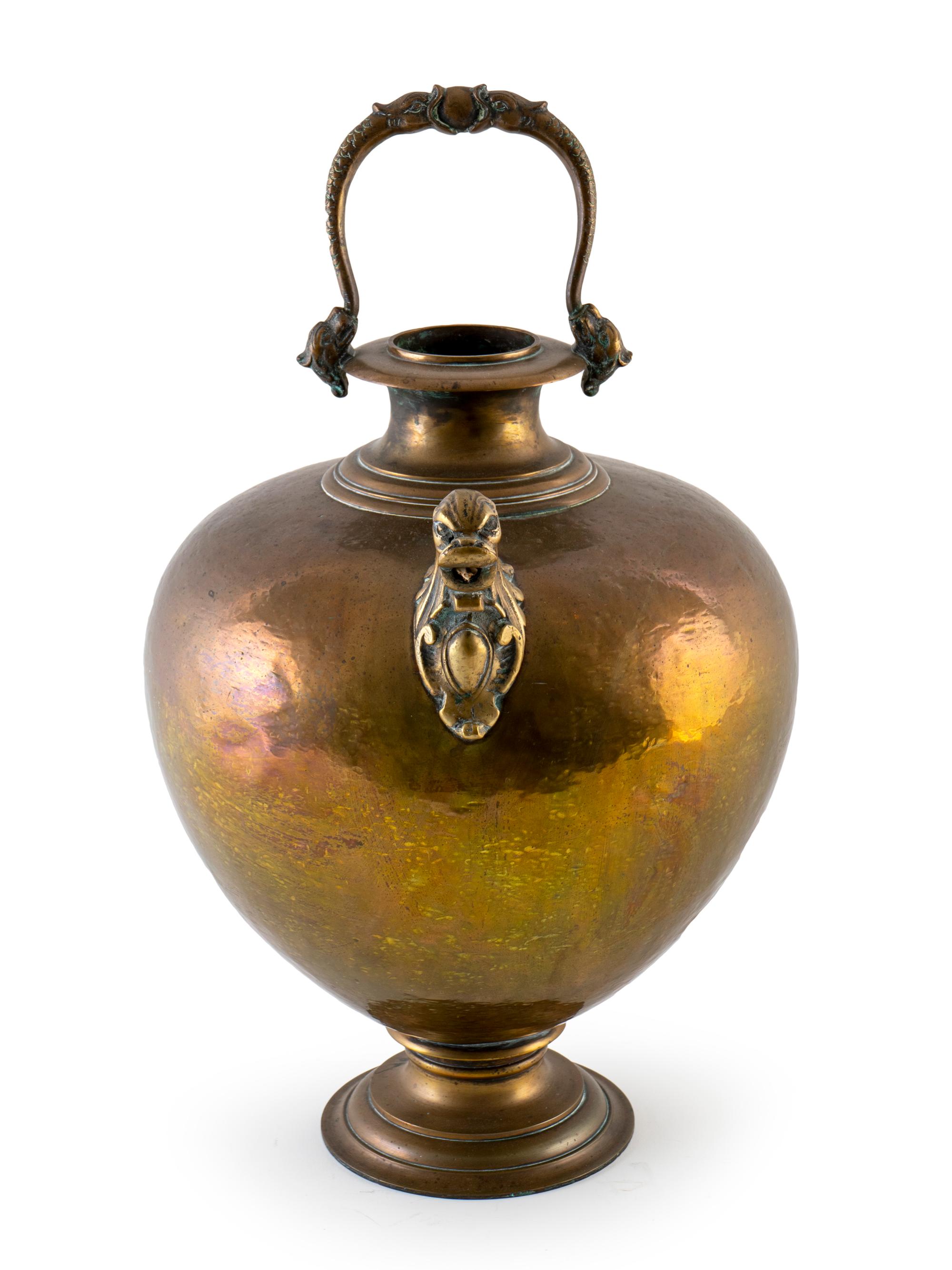 A Hand Beaten Metal Water Carrier — 20TH CENTURY
