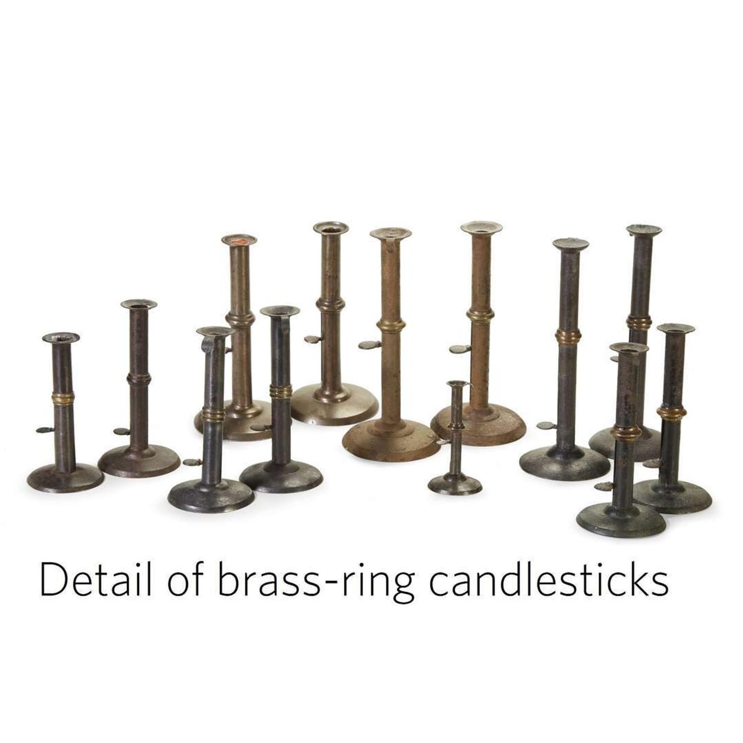 Large collection of thirty-seven iron hogscraper candlesticks 18th/19th century