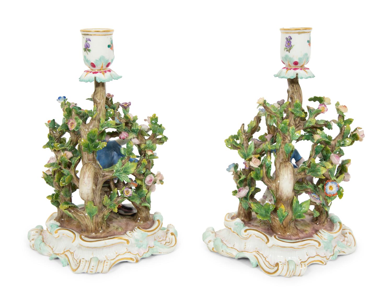 A Pair of Meissen Porcelain Figural Candlesticks with Floral Arbors