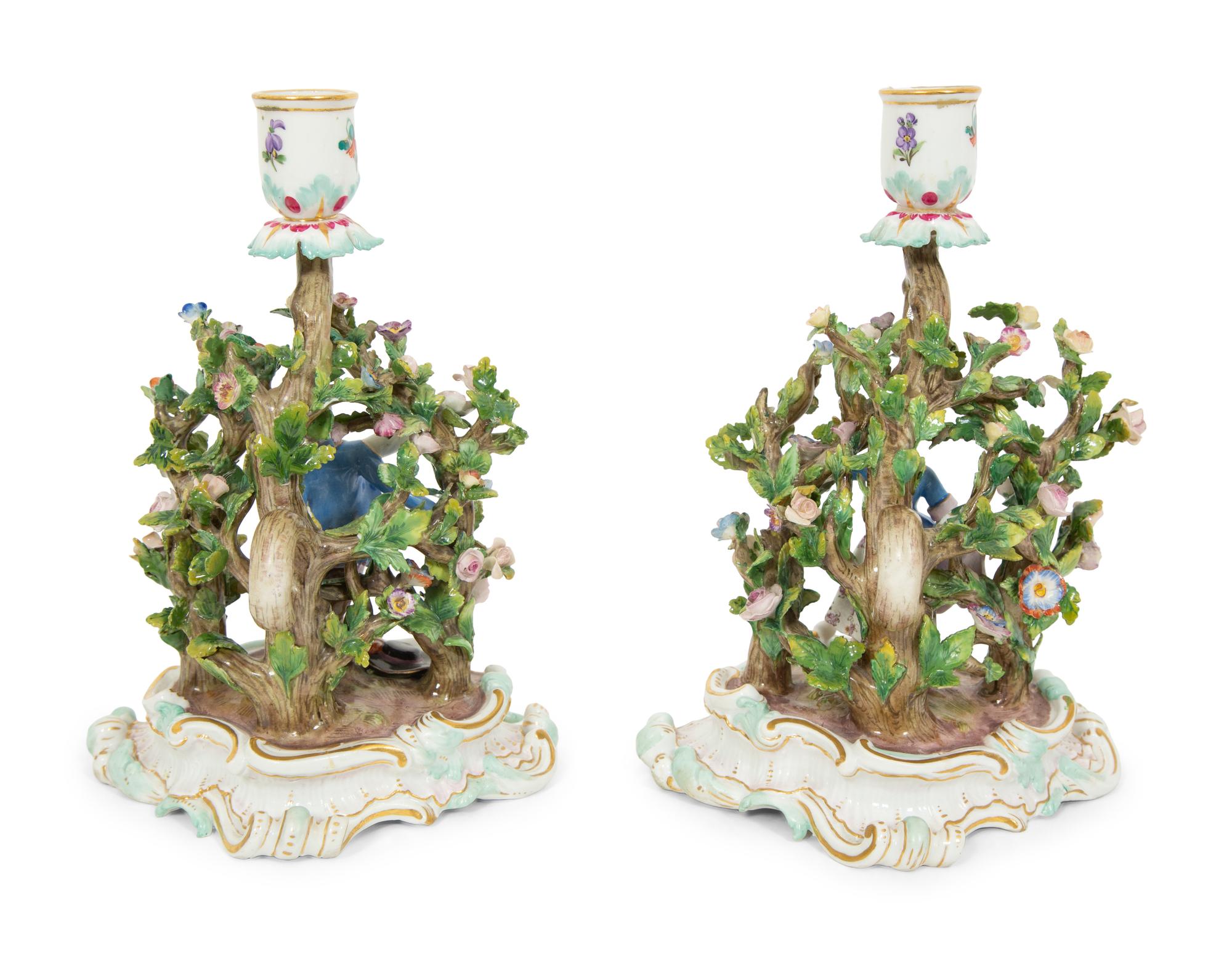 A Pair of Meissen Porcelain Figural Candlesticks with Floral Arbors