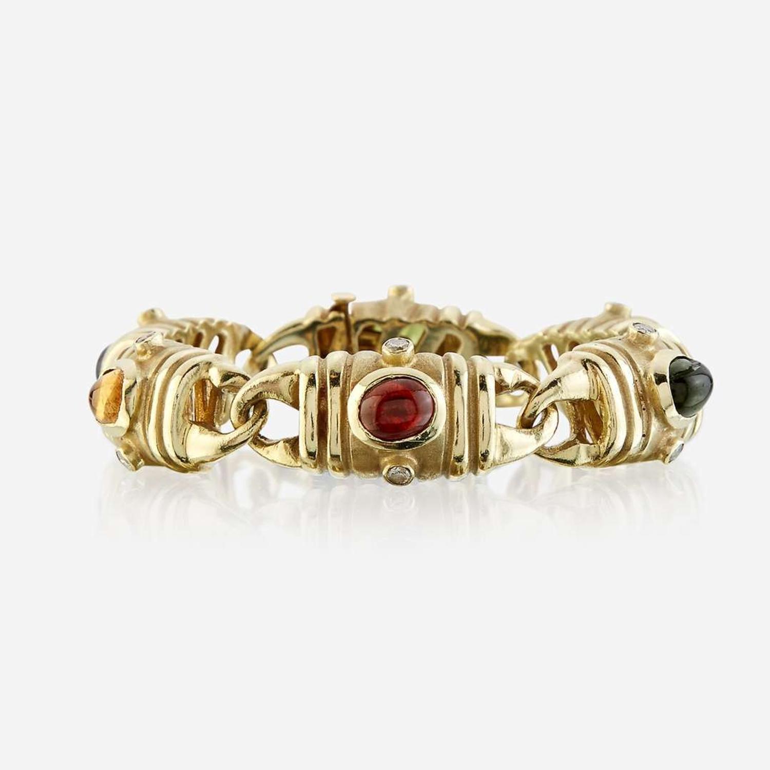 A fourteen karat gold and gem-set bracelet