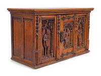 A Renaissance Revival Carved Oak Trunk with Iron Mounts — 19TH/20TH CENTURY