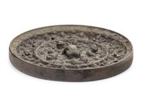 A Chinese Bronze Circular 'Mythical Beasts and Grapes' Mirror