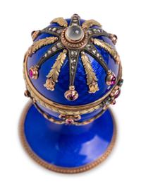 A 14 Karat Vari-Color Gold, Guilloché Enamel, Diamond, and Cabochon Jewel-Mounted Egg-Form Perfume and a Related Guilloché Enamel, 14 Karat Vari-Color Gold, Diamond, and Cabochon-Mounted Surprise Egg