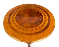 A Regency Style Parcel Gilt Satinwood and Marquetry Table Height 30 x diameter of top 34 1/2 inches. — 20TH CENTURY