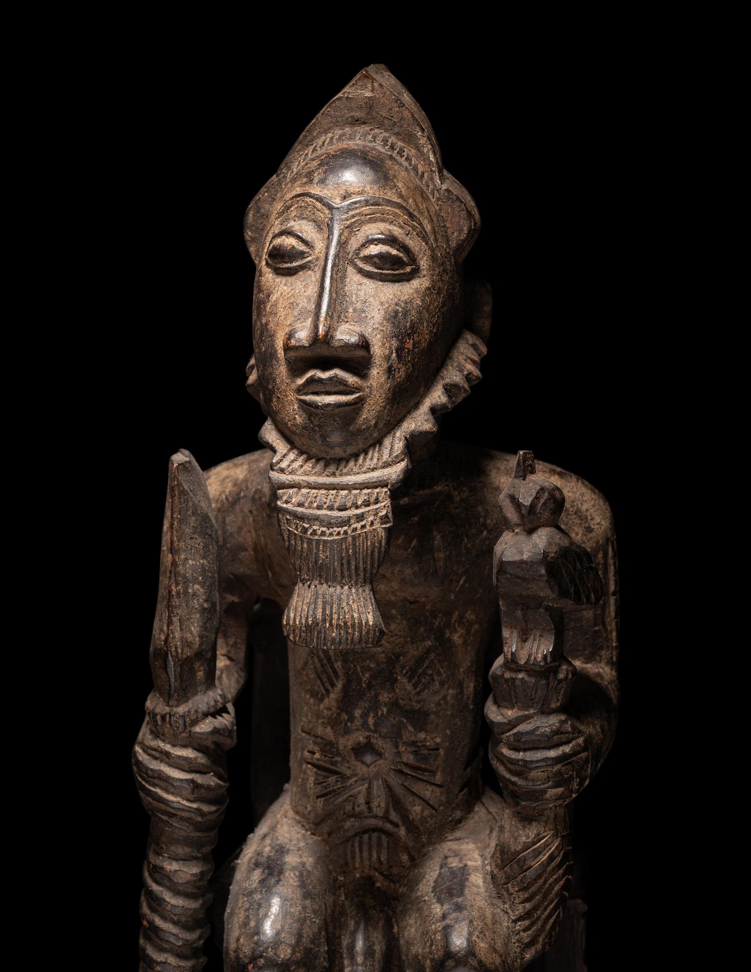 A Baule Wood Seated Male Figure