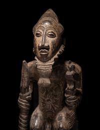 A Baule Wood Seated Male Figure