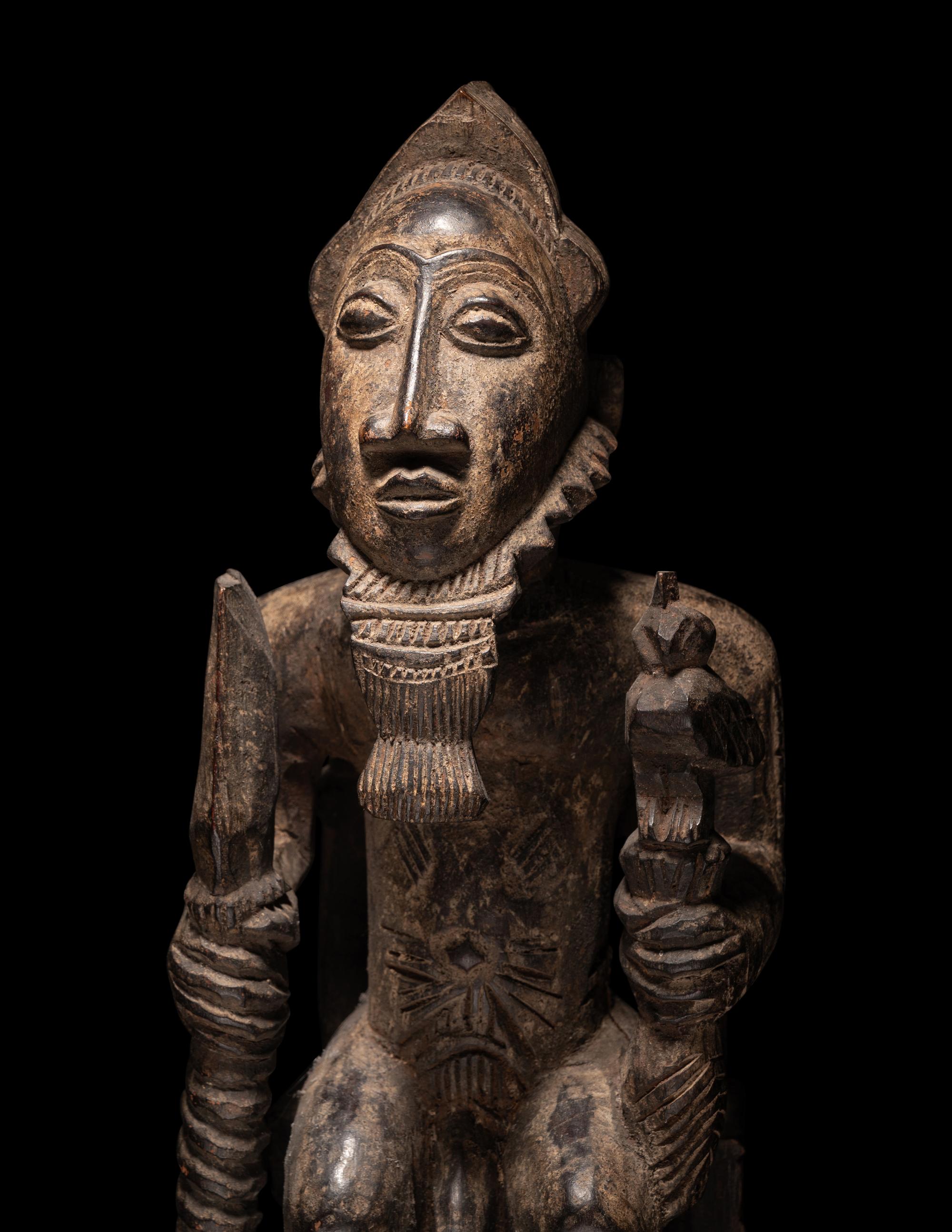 A Baule Wood Seated Male Figure