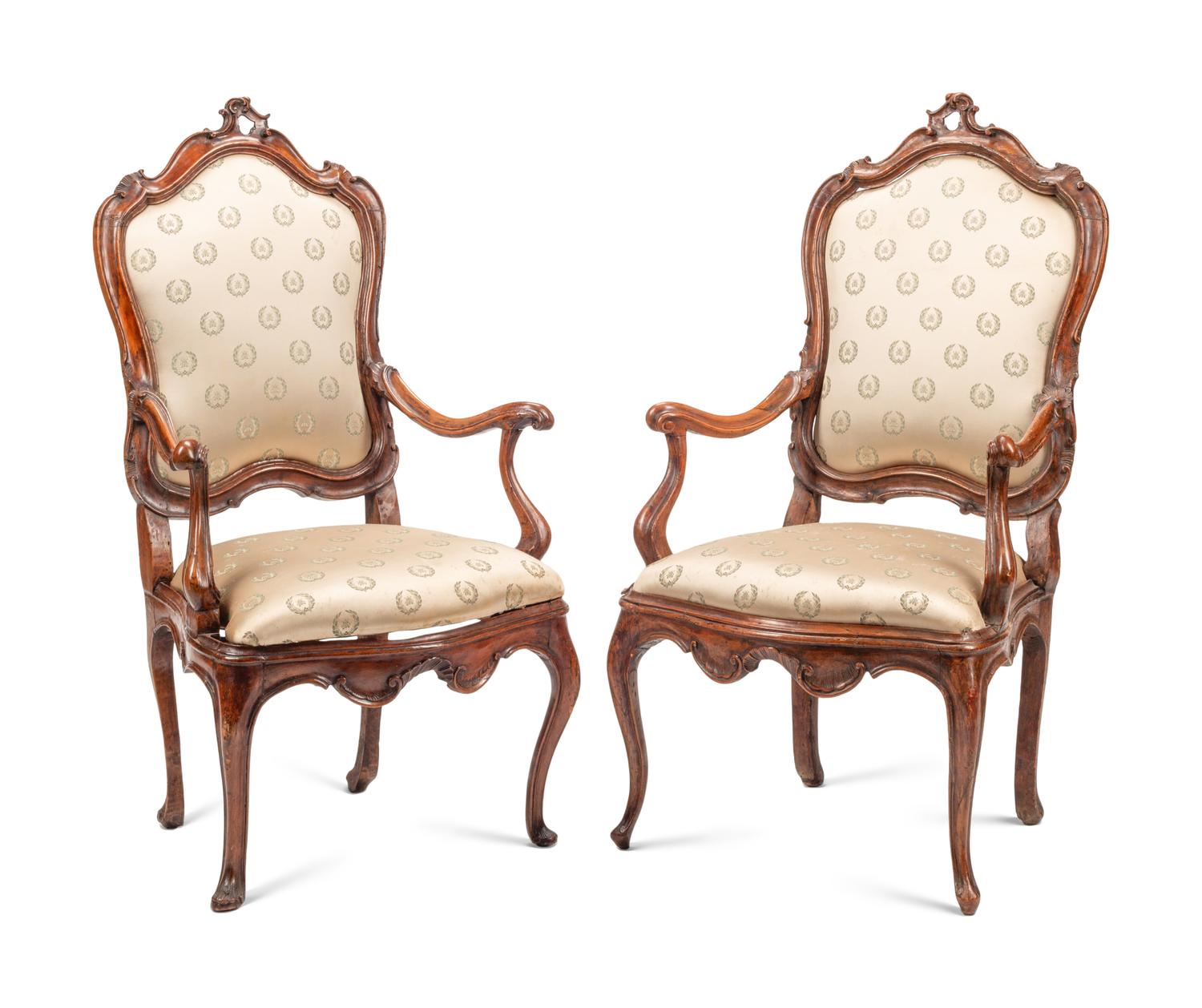 A Pair of Venetian Carved Walnut Armchairs