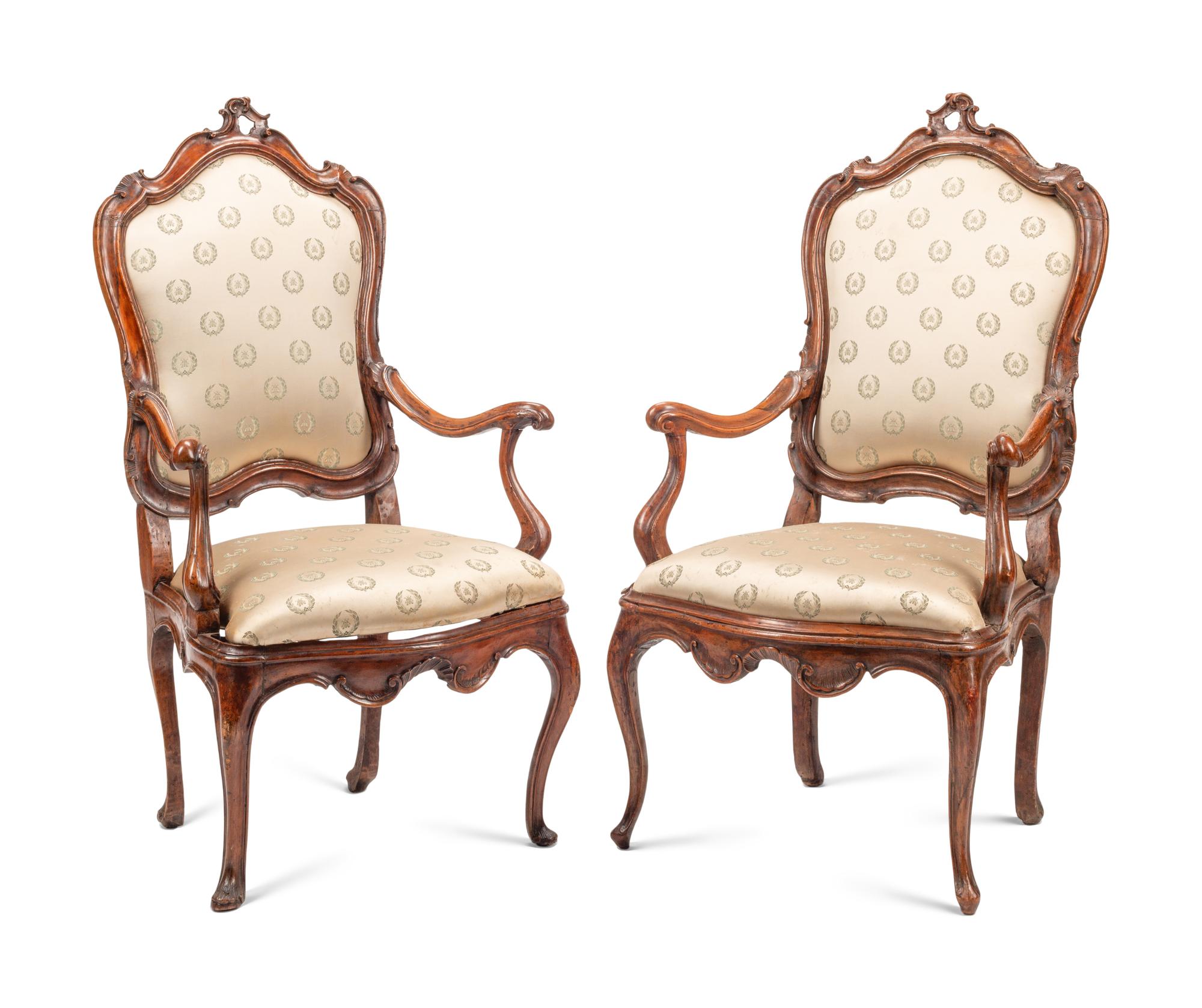 A Pair of Venetian Carved Walnut Armchairs
