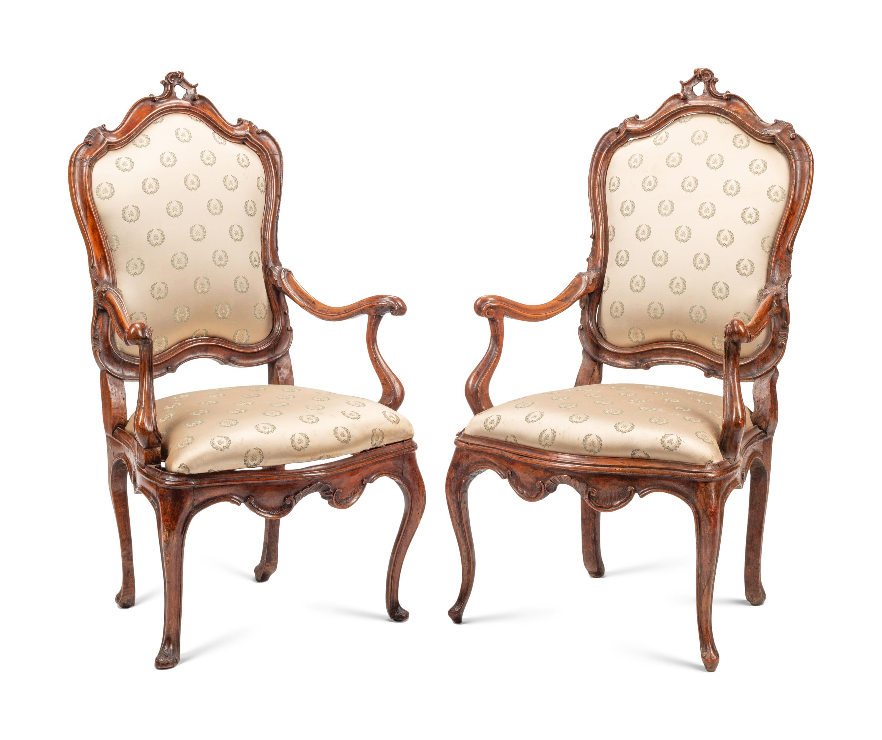 A Pair of Venetian Carved Walnut Armchairs