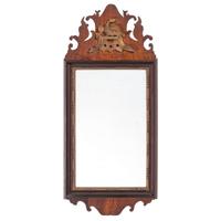 A Chippendale Parcel Gilt and Carved Mahogany Eagle Decorated Looking Glass