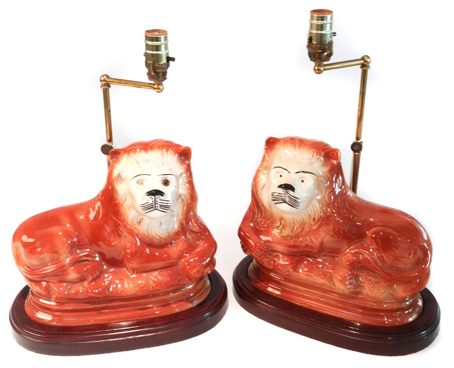 A Pair of English Staffordshire Style Ceramic Lions Height 9 1/4 x length 10 1/2 inches.