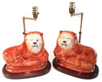 A Pair of English Staffordshire Style Ceramic Lions Height 9 1/4 x length 10 1/2 inches.