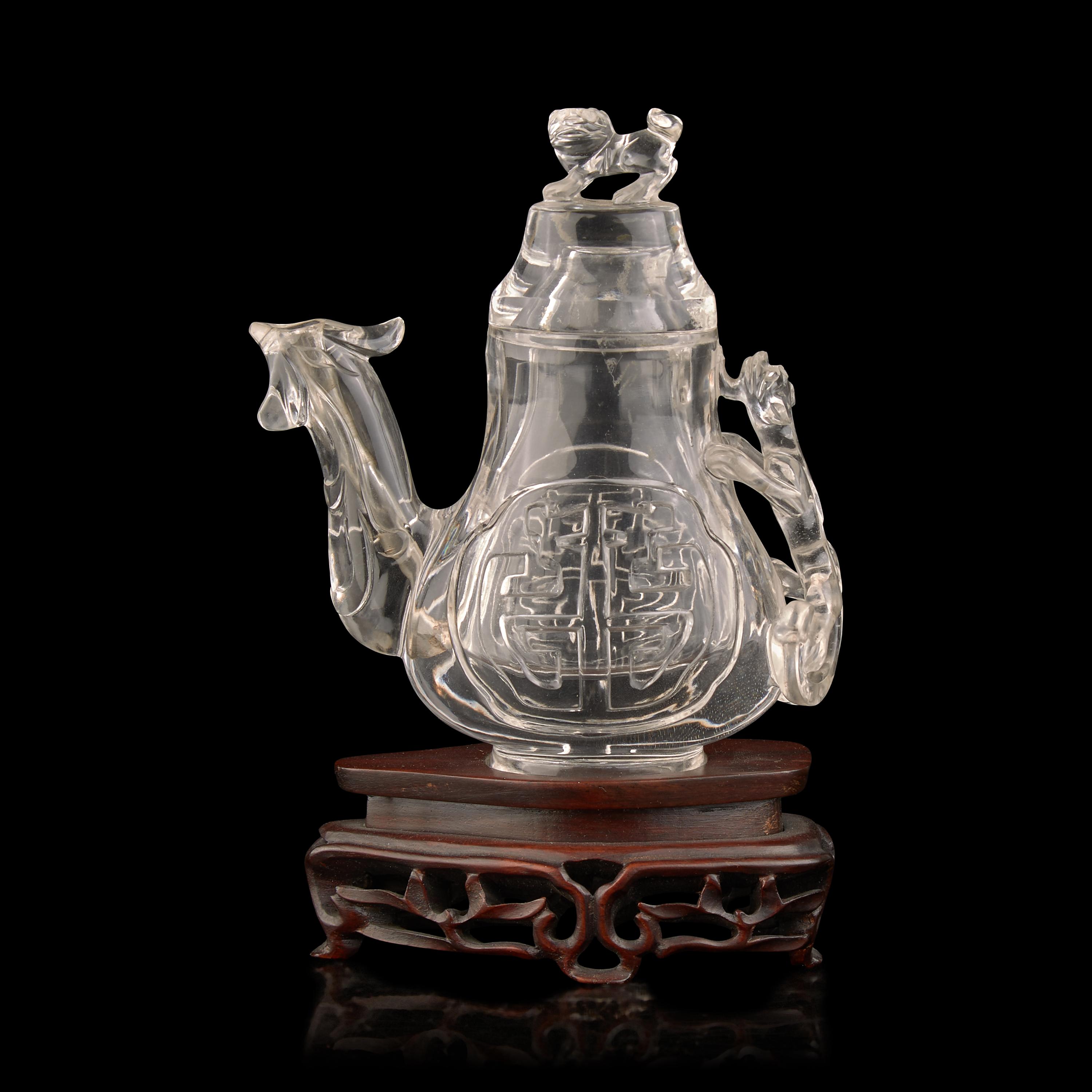 A Chinese Rock Crystal 'Phoenix' Ewer-Form Vase and Cover, 20th Century 近代 雕水晶鳳形蓋瓶