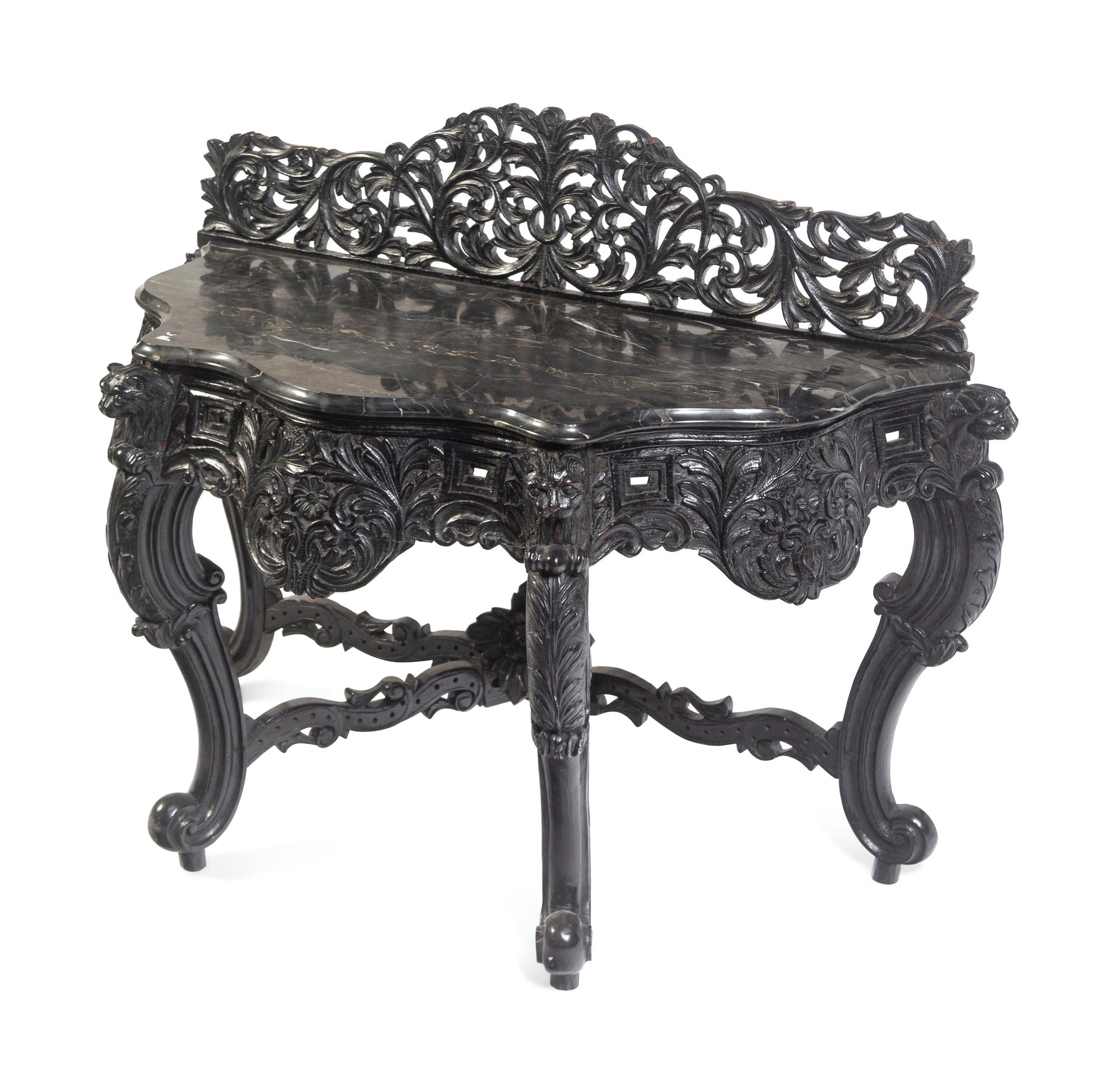 An Anglo-Indian Carved and Ebonized Console Table