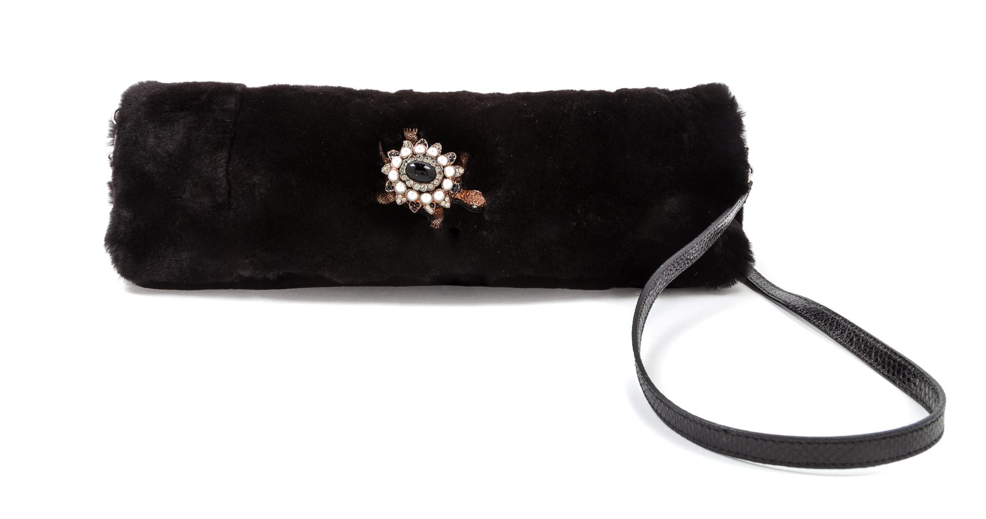 A Salvatore Ferragamo Dark Brown Mink Clutch, 12" x 5" x 3"; Strap drop: 17.5".