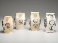 A Wedgwood Britannia and Etruria Panel and Nautical Creamware Pitchers