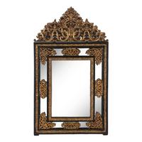 A Baroque Style Gilt Metal Mounted Ebonized Mirror