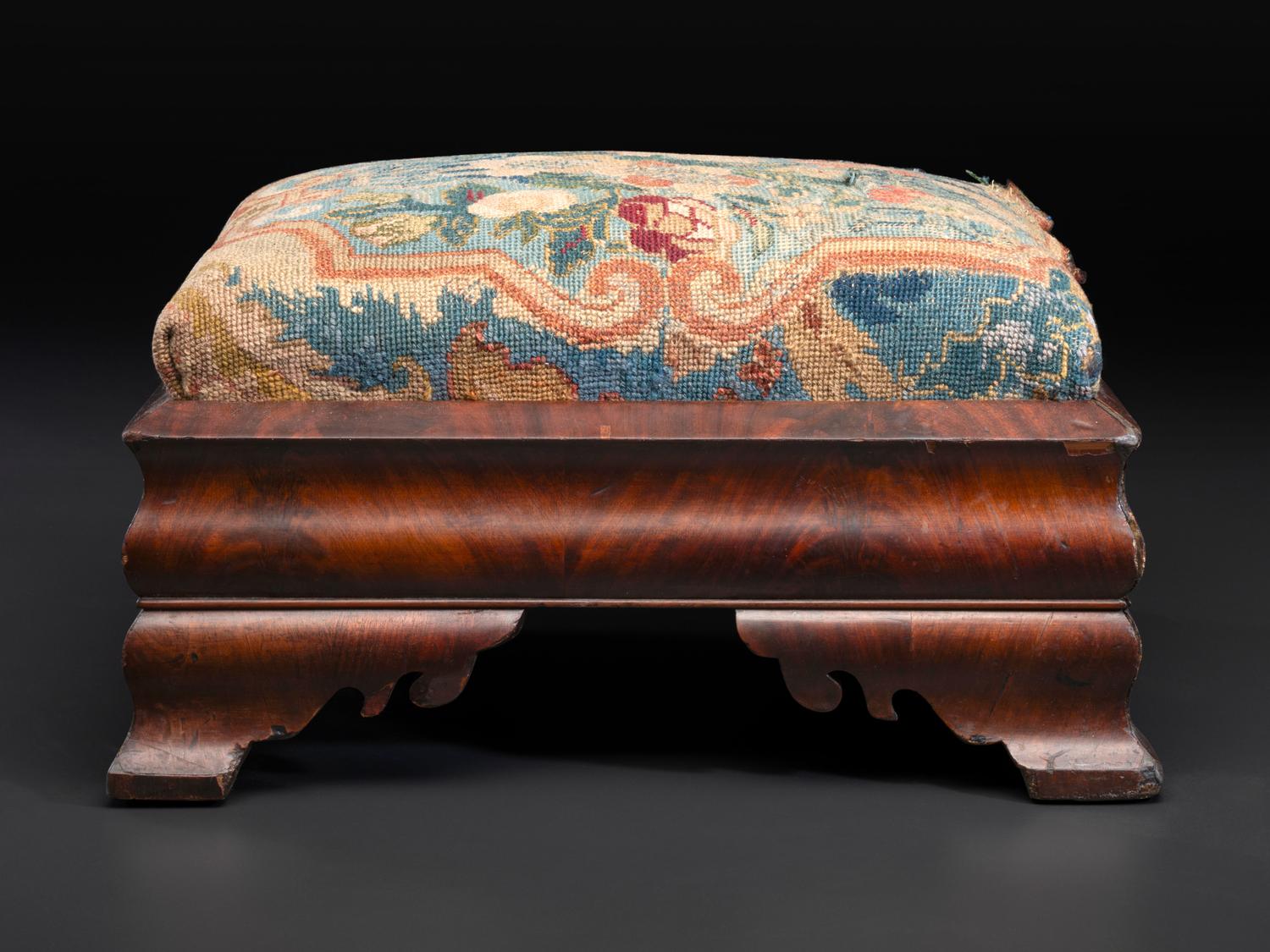 An American Empire Mahogany Veneered and Needlepoint Upholstered Footstool