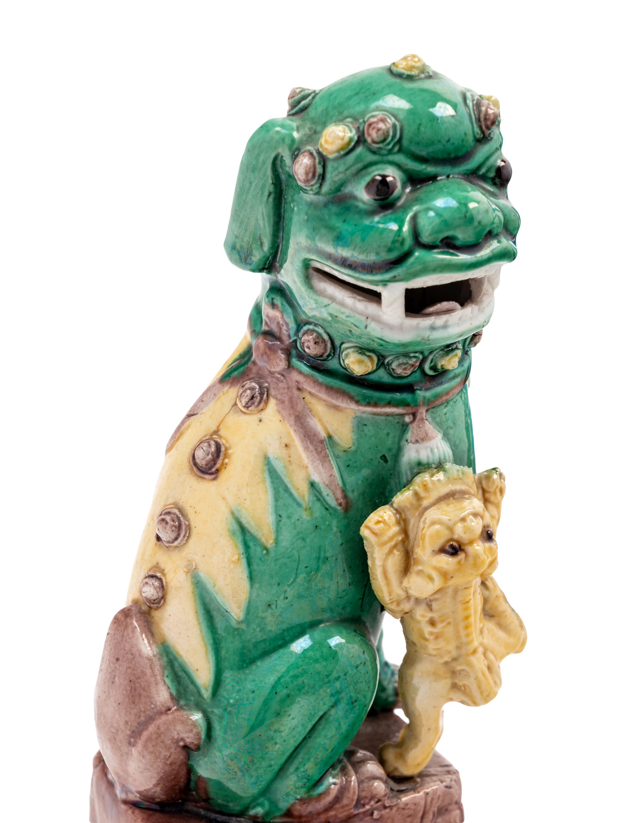 Three Chinese Porcelain Figures of Fu Lions