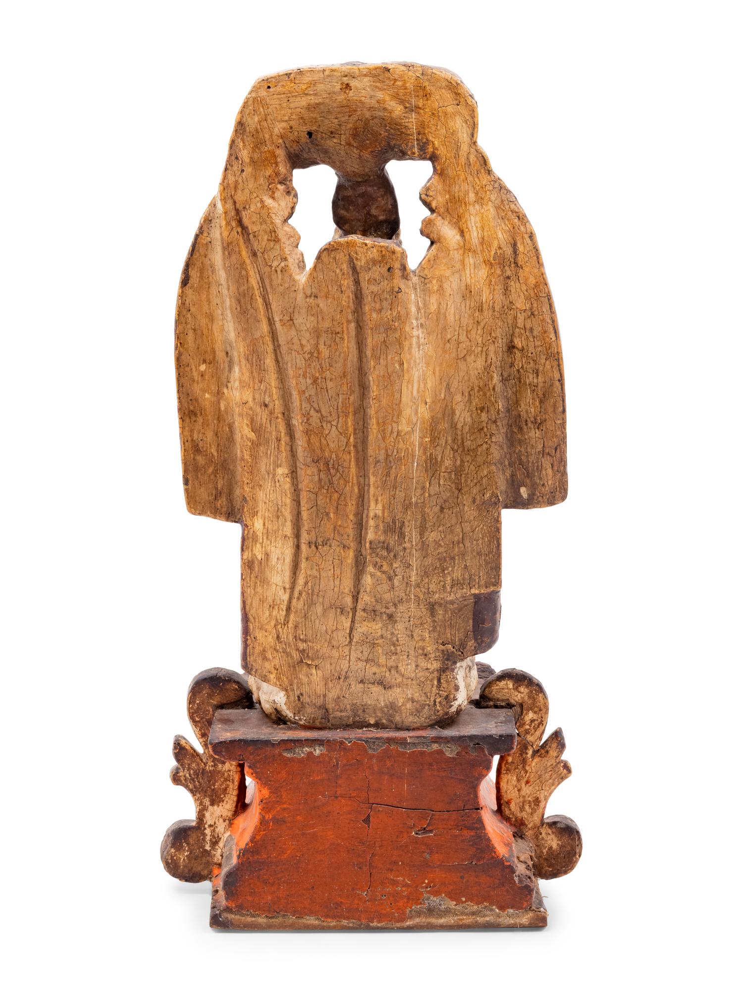 A Spanish Carved and Painted Wood Santos Group