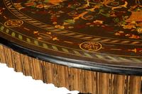 A Continental Polychrome Marquetry and Parcel Gilt Center Table