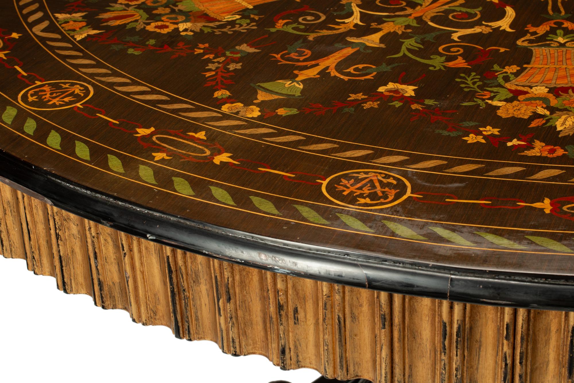 A Continental Polychrome Marquetry and Parcel Gilt Center Table