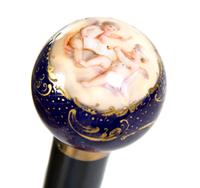 A Sevres Style Porcelain Mounted Walking Stick, Height overall 35 1/2 x diameter of handle 1 1/2 inches.