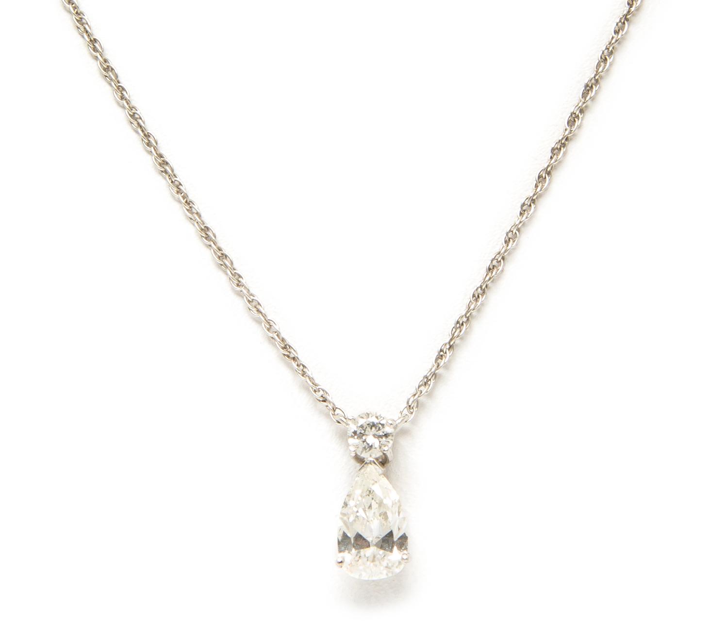 A White Gold and Diamond Pendant Necklace, 1.00 dwts.
