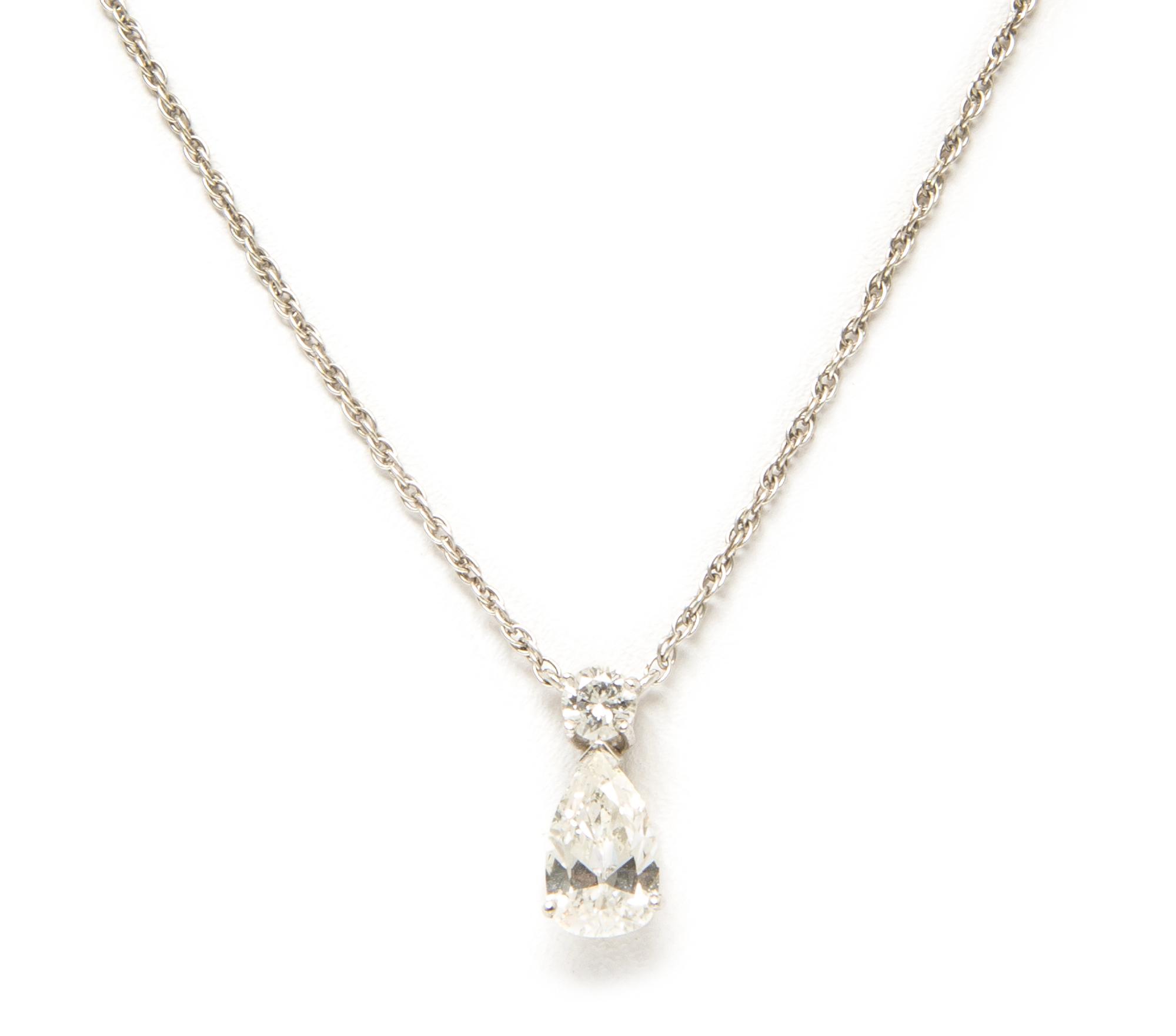 A White Gold and Diamond Pendant Necklace, 1.00 dwts.