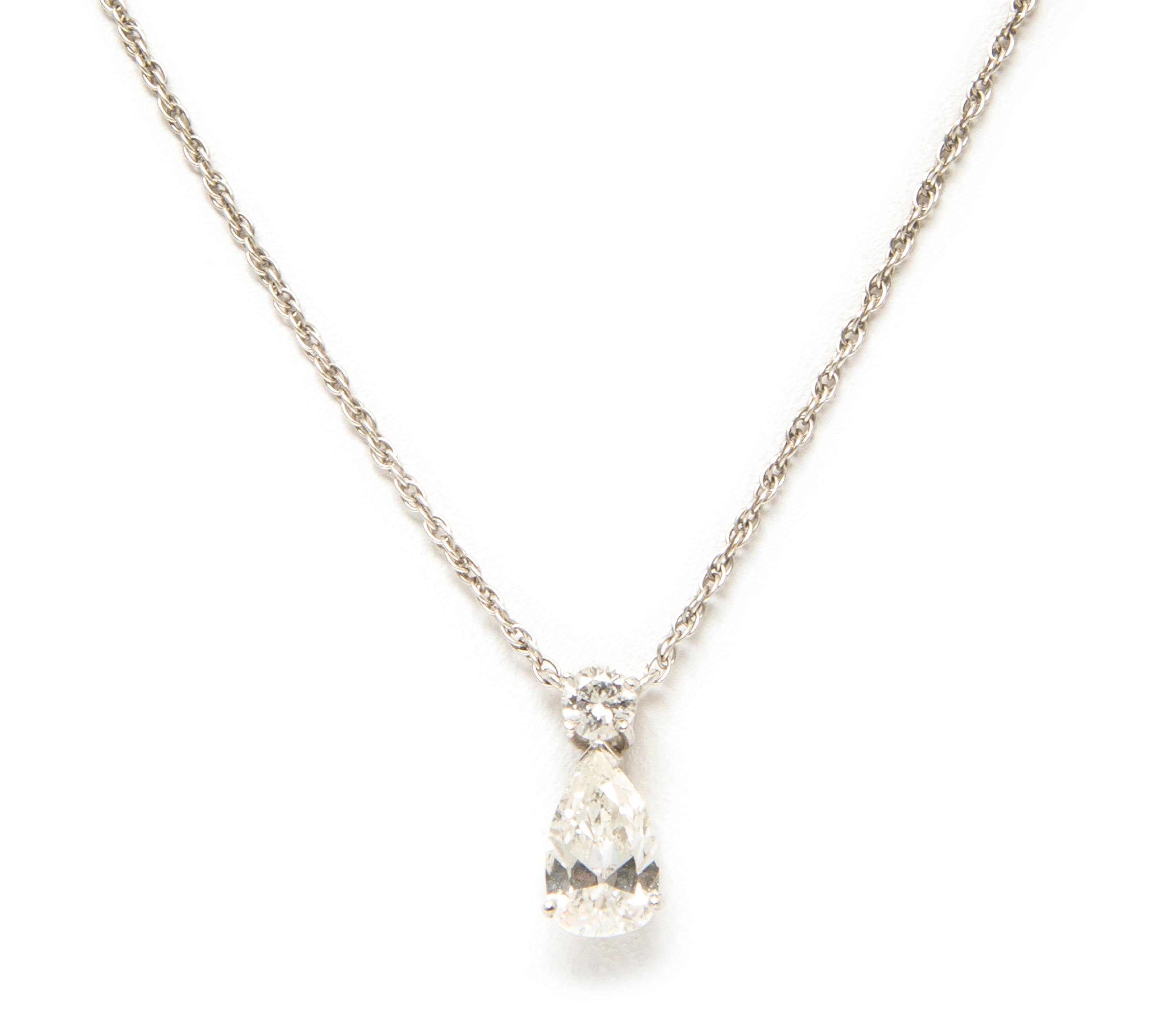 A White Gold and Diamond Pendant Necklace, 1.00 dwts.