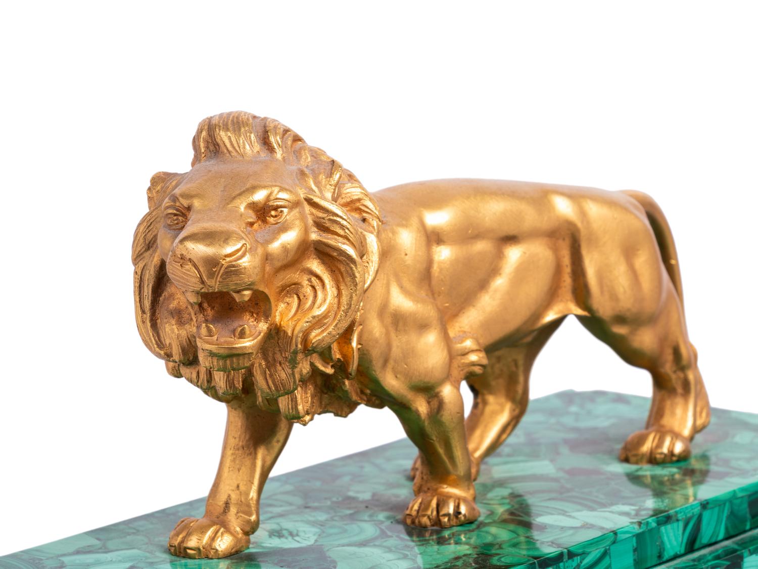 An Empire Style Gilt Metal and Malachite Veneered “Crystal Regulator" Clock