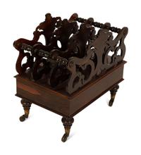 A Late Regency Carved Mahogany Canterbury