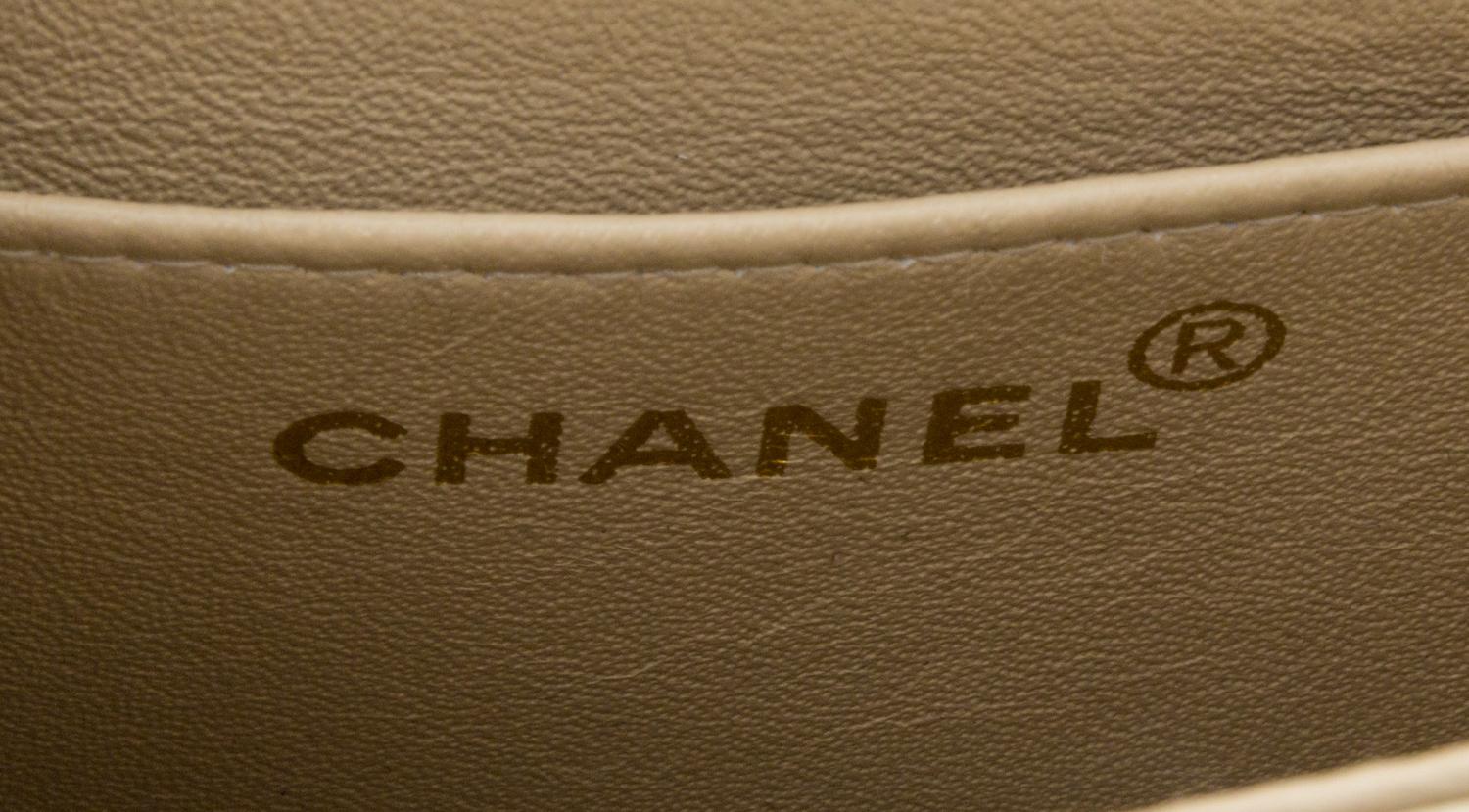 A Chanel Cream Calfskin Leather Small Flap Handbag, 6.5" x 5.5" x 2.5".