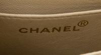 A Chanel Cream Calfskin Leather Small Flap Handbag, 6.5" x 5.5" x 2.5".