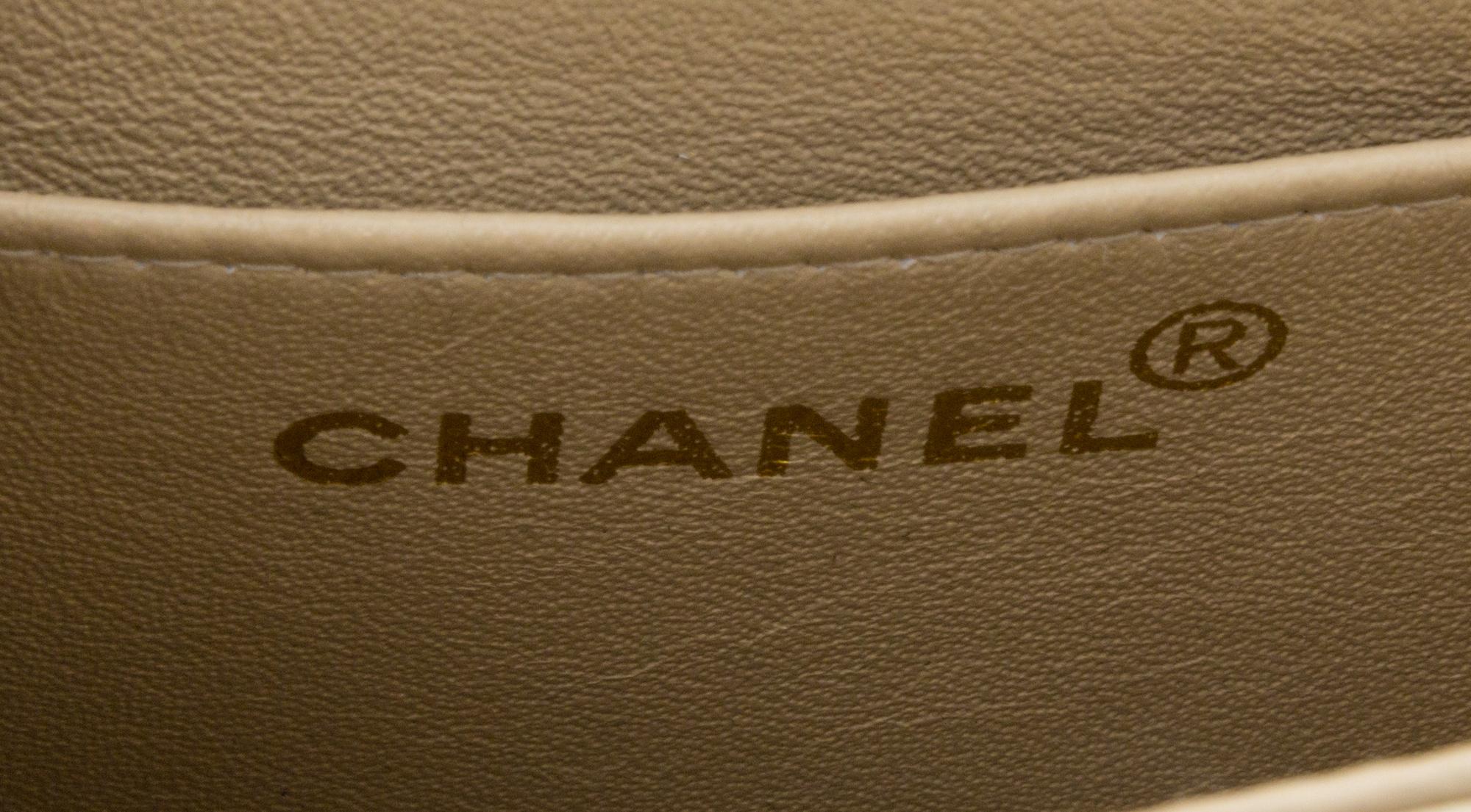 A Chanel Cream Calfskin Leather Small Flap Handbag, 6.5" x 5.5" x 2.5".